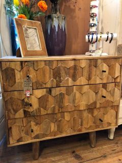 handcarved light mango wood chest of drawers with hexagonal panels