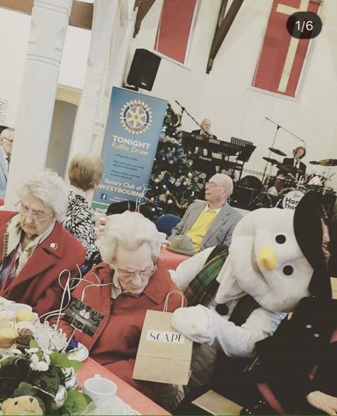 A Little Bit of Christmas Giving 11 Scapey the snowman giving presents 482x594 1