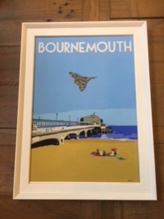 Vintage style framed print of Bournemouth beach with Vulcan bomber