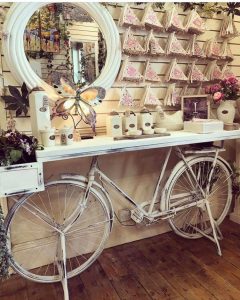 retro white washed painted upcycled bike table with a basket