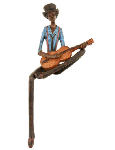 Shelf sitting jazz guitar player figurine