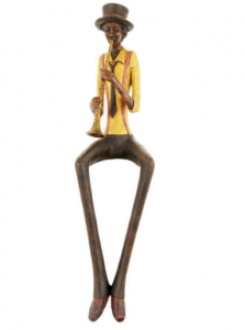 vintage style shelf sitting trumpet player figurine