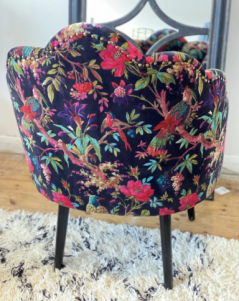 the back of our unique fan shaped birds of paradise occasional chair