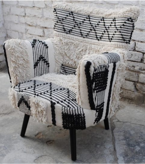 black and white boho chair with pompoms and tassels