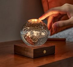 Amber Crystal Ball Solar System LED Light on wooden stand